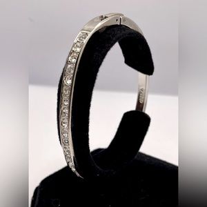 Beautiful Oval Silver Tone Bangle Bracelet with a Row of Faceted Crystals